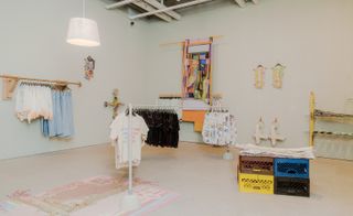 Exhibition view of Posessed featuring clothing by Eckhaus Latta