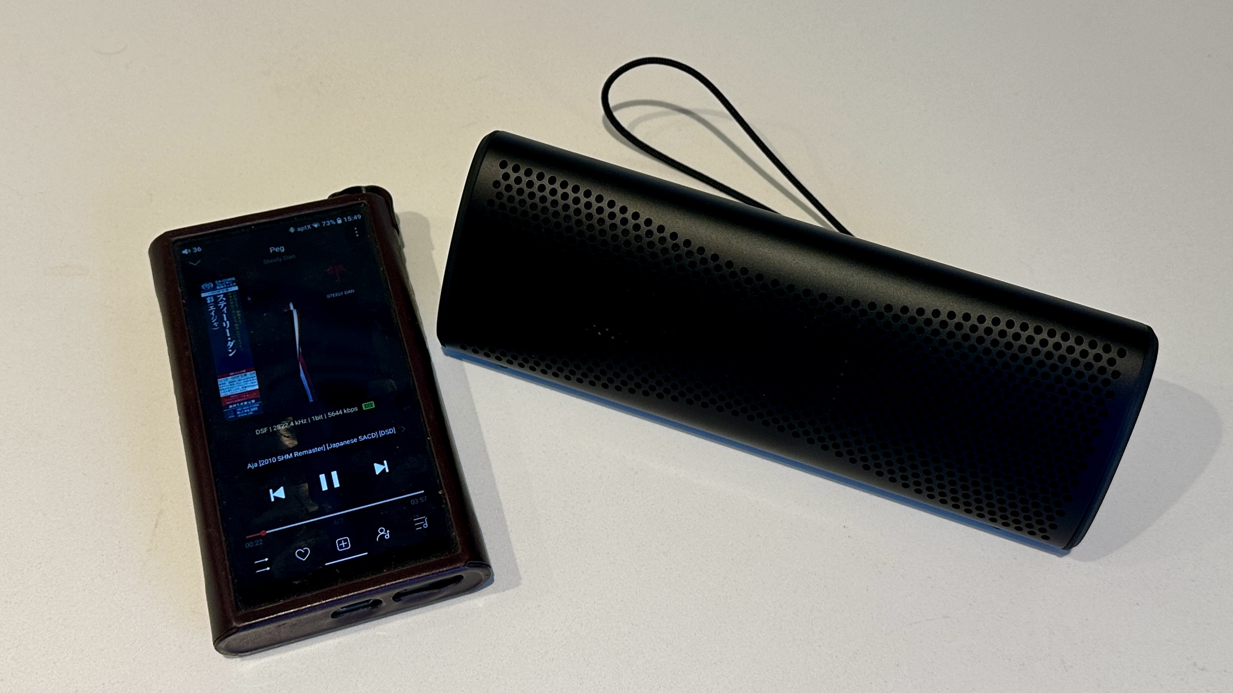 KEF Muo 2025 in black, on a white table