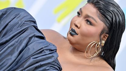 Lizzo Has Volume for Days at MTV VMAs Red Carpet 2022 in Blue Dress