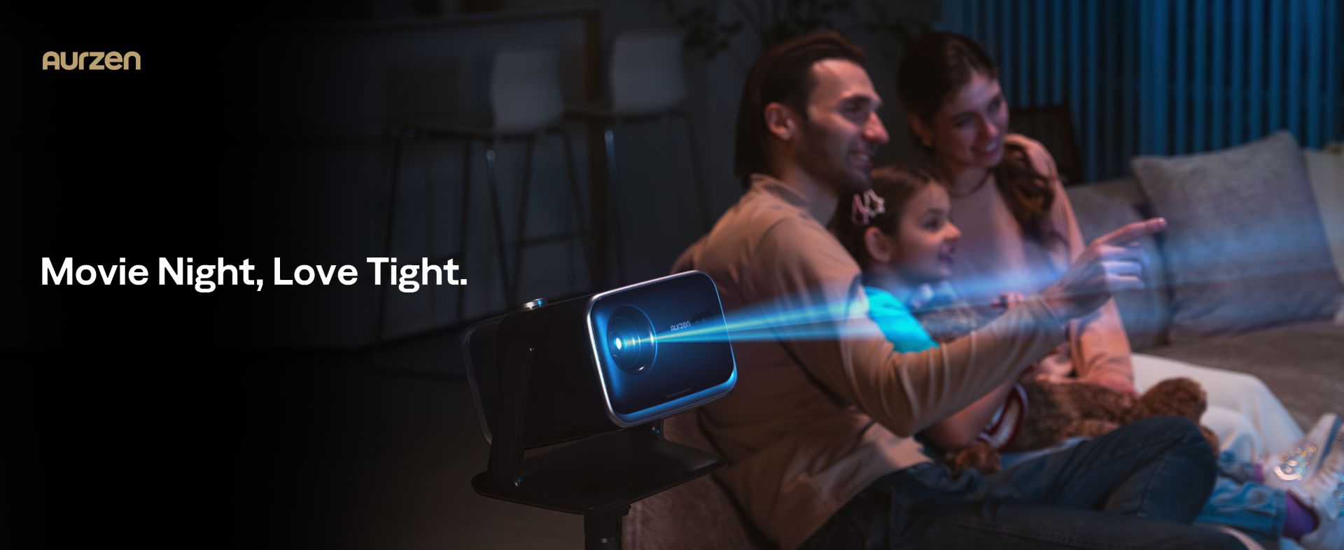 An Aurzen BOOM mini projecting a movie while a family watches
