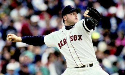 Roger Clemens pitches for the Boston Red Sox in 1990: With 300 wins and 4,000 strikeouts under his belt, Clemens remains one of baseball's greatest pitchers.