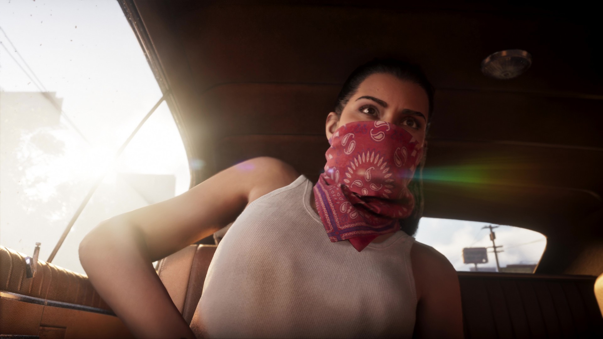Riding passenger, Lucia stows her gun while wearing a red bandana and white vest, from the GTA 6 extended look