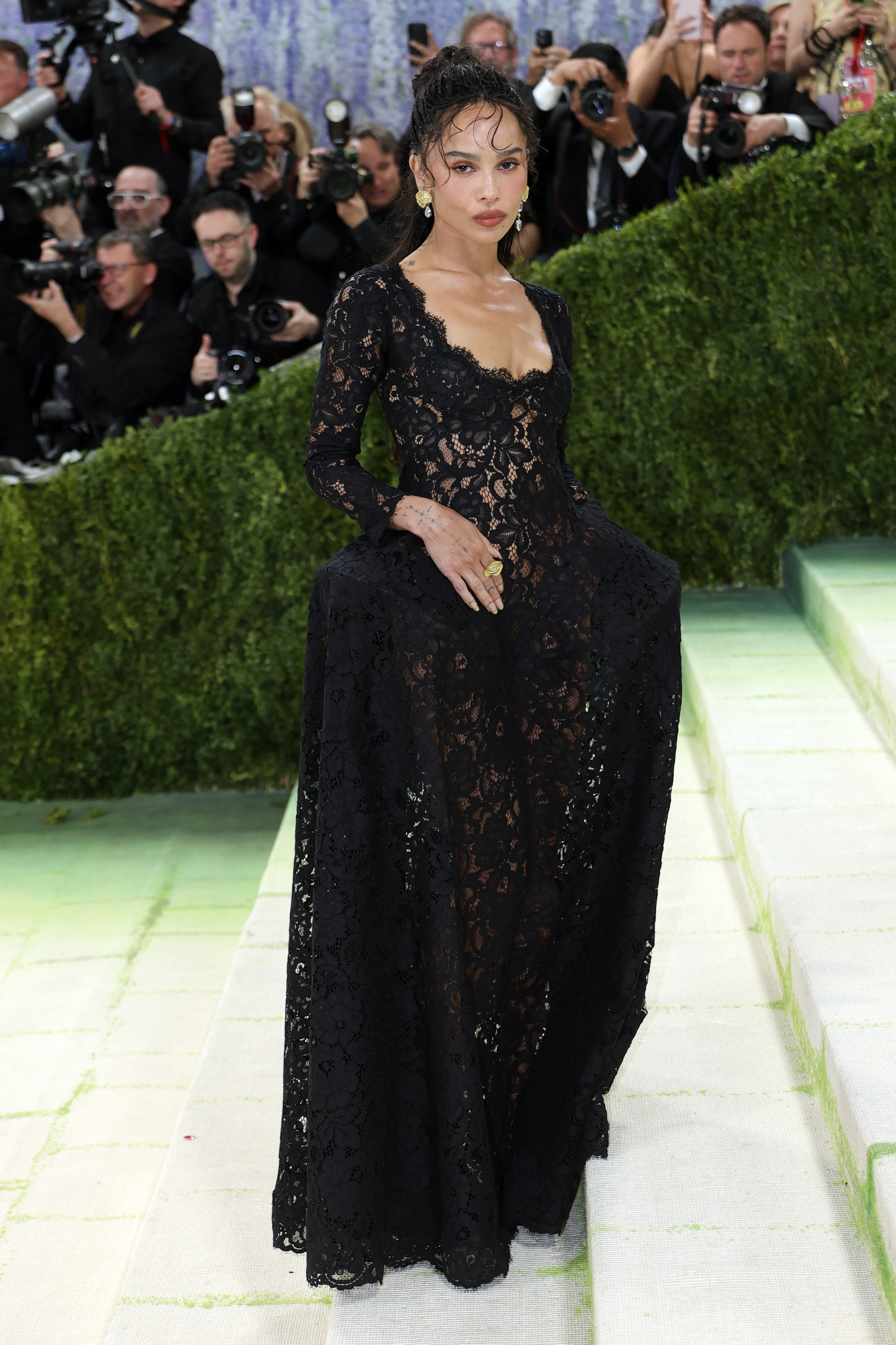 zoe kravitz wears a lace saint laurent dress.
