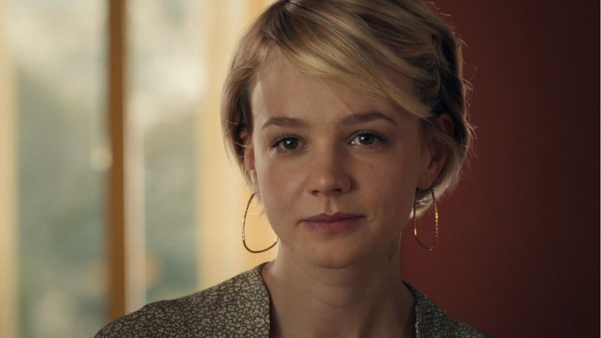 Carey Mulligan smiling in her apartment in Drive.