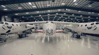 Virgin Galactic's SpaceShipTwo sits beneath its launch aircraft White Knight Two.