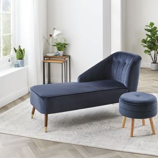 living room with blue chaise longue and wooden flooring
