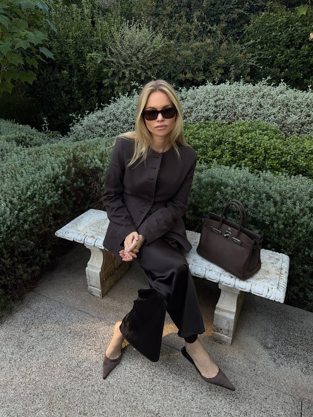 @clairerose wears black silk trousers brown blazer
