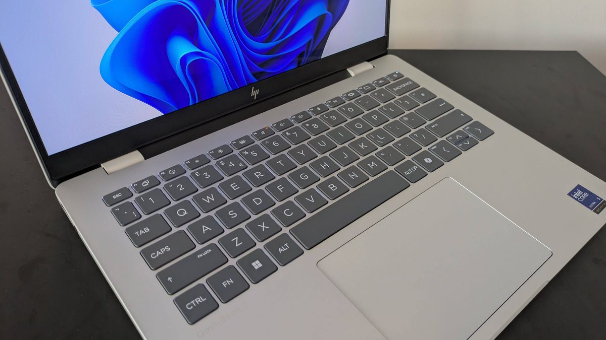 Close-up of keyboard on HP OmniBook 7 14-inch with white wall in background