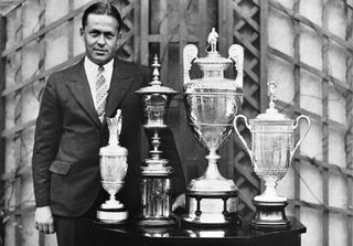 Bobby Jones with Jones' 1930 grand slam trophies: the British Open, the U.S. Amateur, the British Amateur and the U.S. Open. Why is The Masters A Major?
