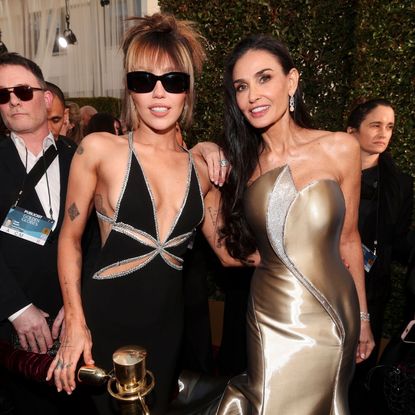 Miley Cyrus and Demi Moore attends the 82nd Annual Golden Globes