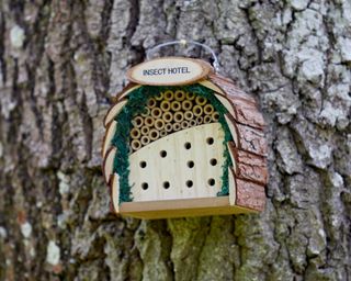 NATURAL WOOD INSECT HOTEL WITH BARK ROOF, £23.99, Gardenesque