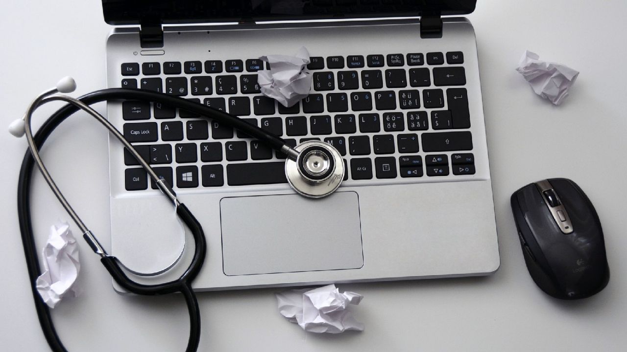 Laptop with stethoscope resting on it