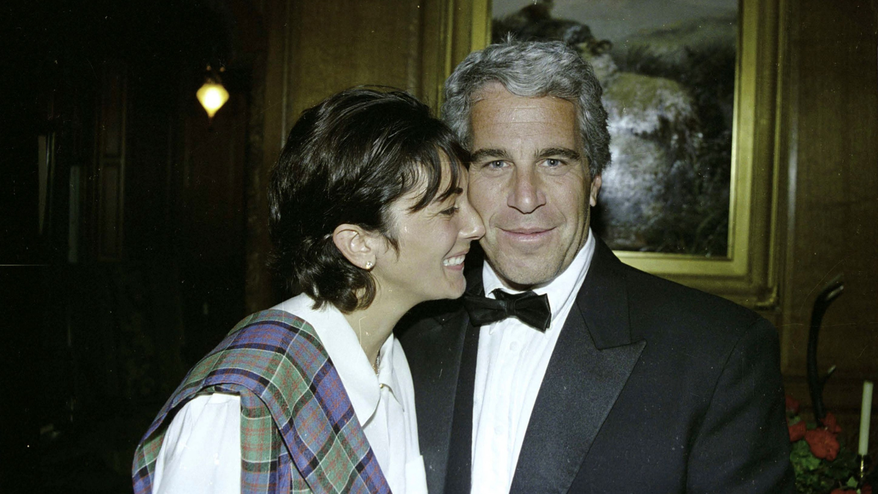 Ghislaine Maxwell poses with Jeffrey Epstein at a black tie event