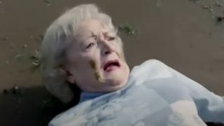 Betty White lays on the ground after getting tackled.