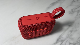 The JBL Go 4 shot from above, showing off the buttons on top