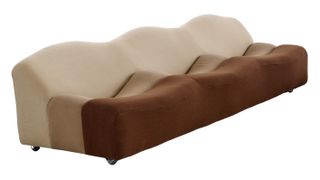 a brown wavy sofa designed by pierre paulin