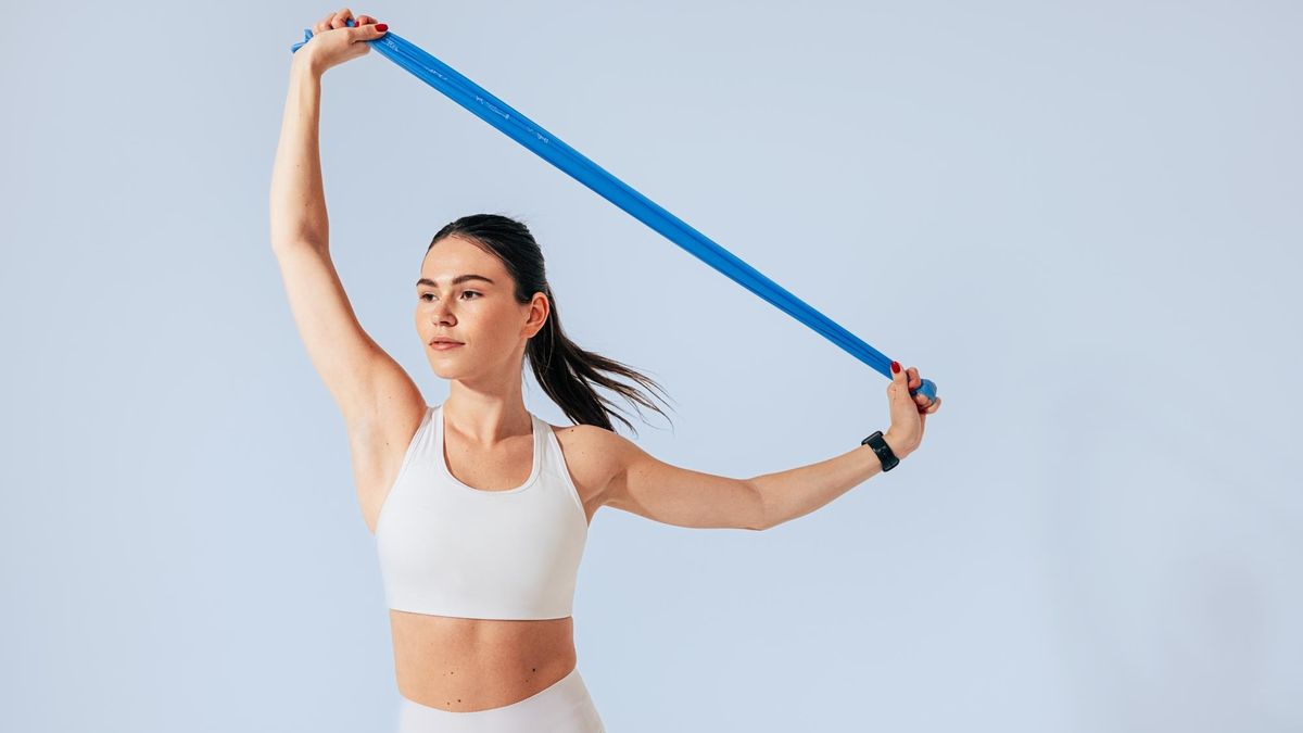 Woman stretching with a resistance band