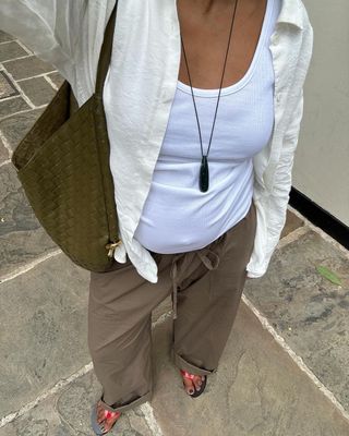 Monikh in cargo pants, vest top and necklace