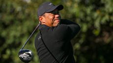 Tiger Woods takes a shot in a practice round before the Genesis Invitational