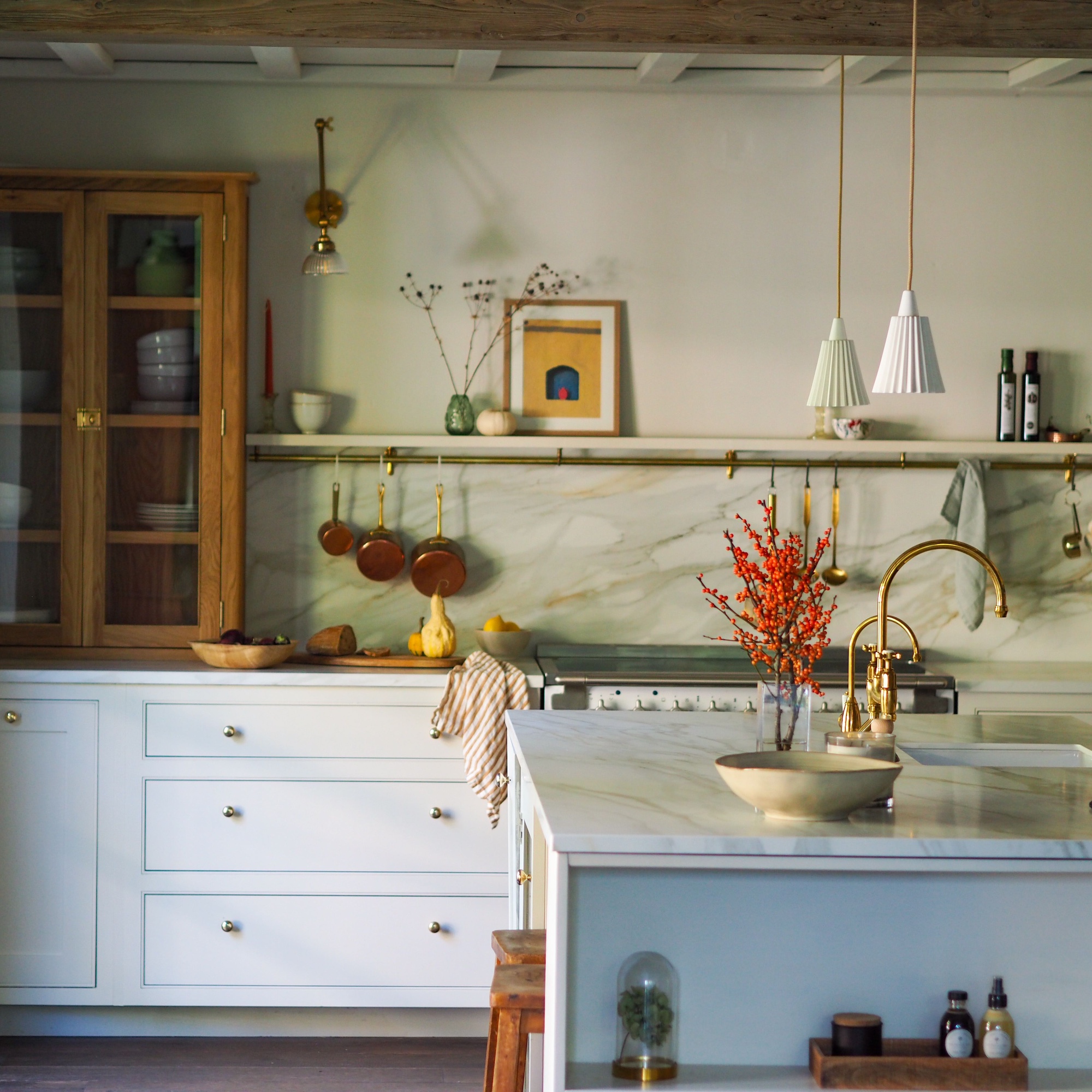 kitchen with white units and marble-like worktops