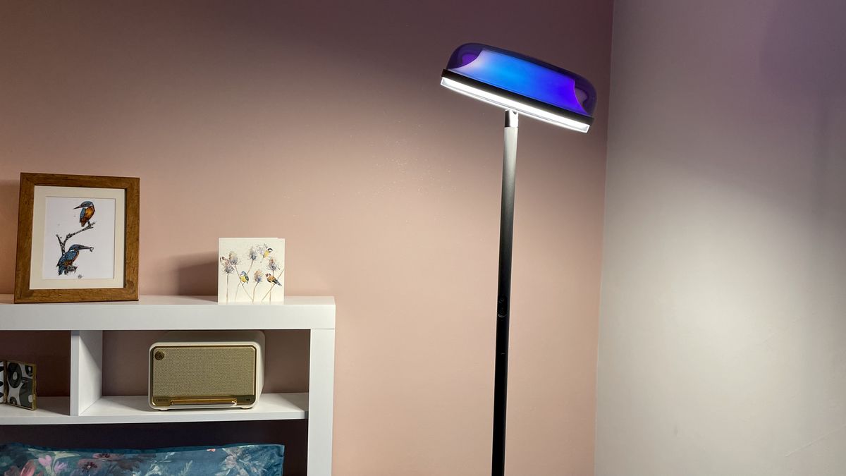 The downlight of the Govee Uplighter is casting light onto a bed.