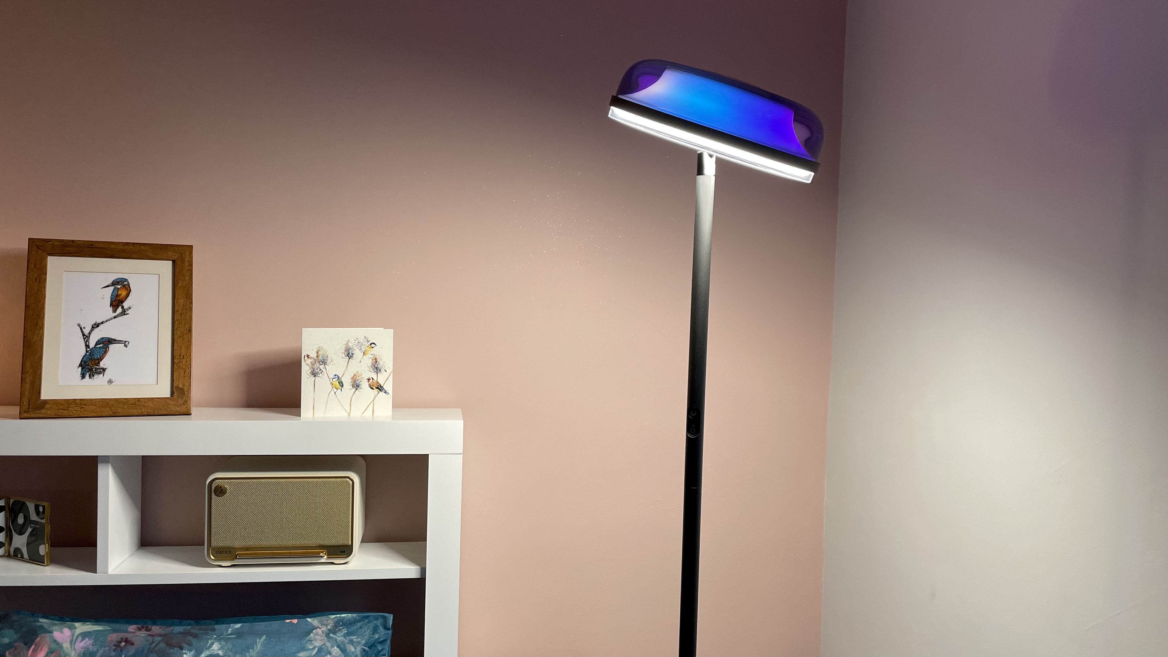 The downlight of the Govee Uplighter is casting light onto a bed.