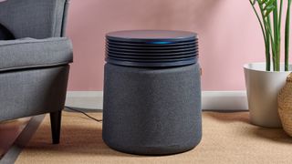 The Blueair Blue Signature air purifier is pictured in a pink living room.