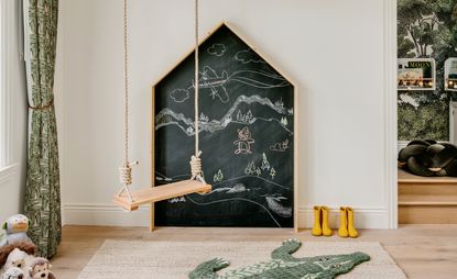 a kids room with a chalkboard wall decoration