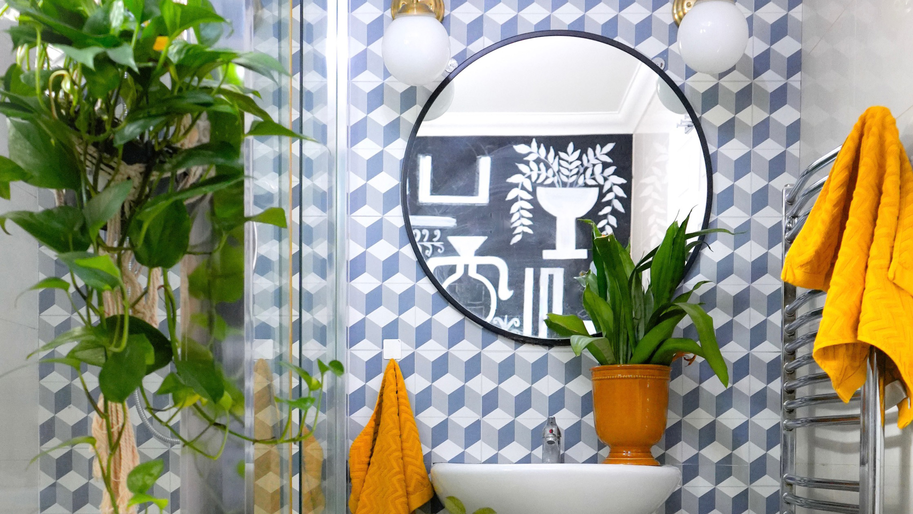 bathroom with blue patterned tiles on the wall