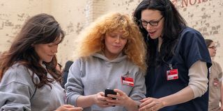 orange is the new black season 7 looking at cell phone