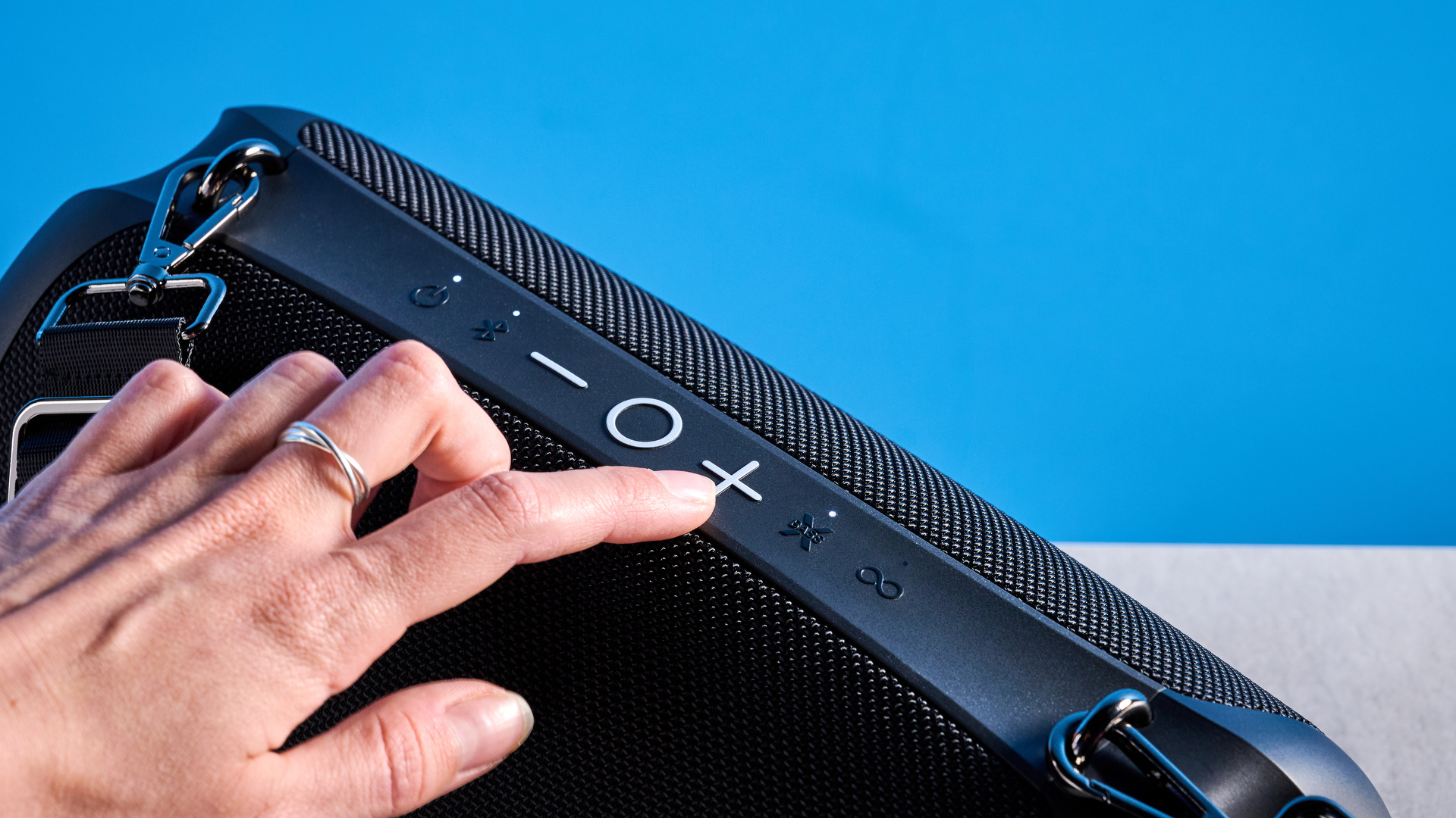 Tribit StormBox Lava Bluetooth Speaker photographed in front of a blue background.