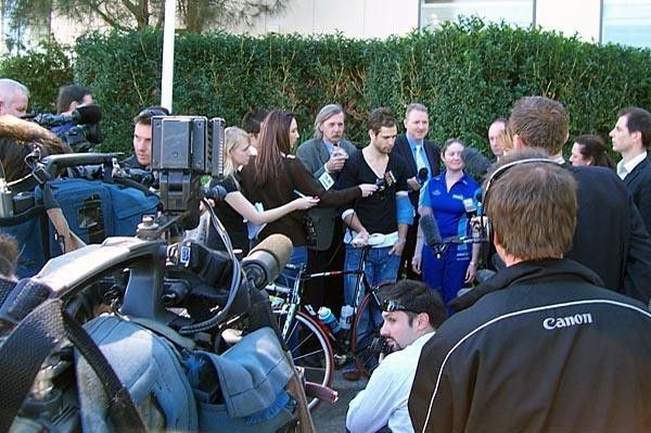 The media scrum gathers around