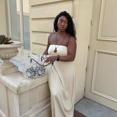 Nnenna with a lace tote in a sundress