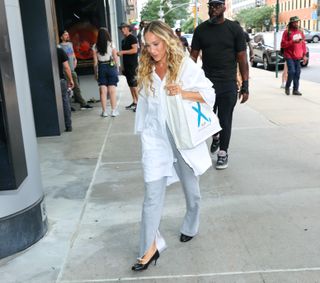 sarah jessica parker walking in New york city wearing a new hybrid shoe