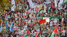 Protesters march with Palestinian flags and pro-Palestine placards during the demonstration in London