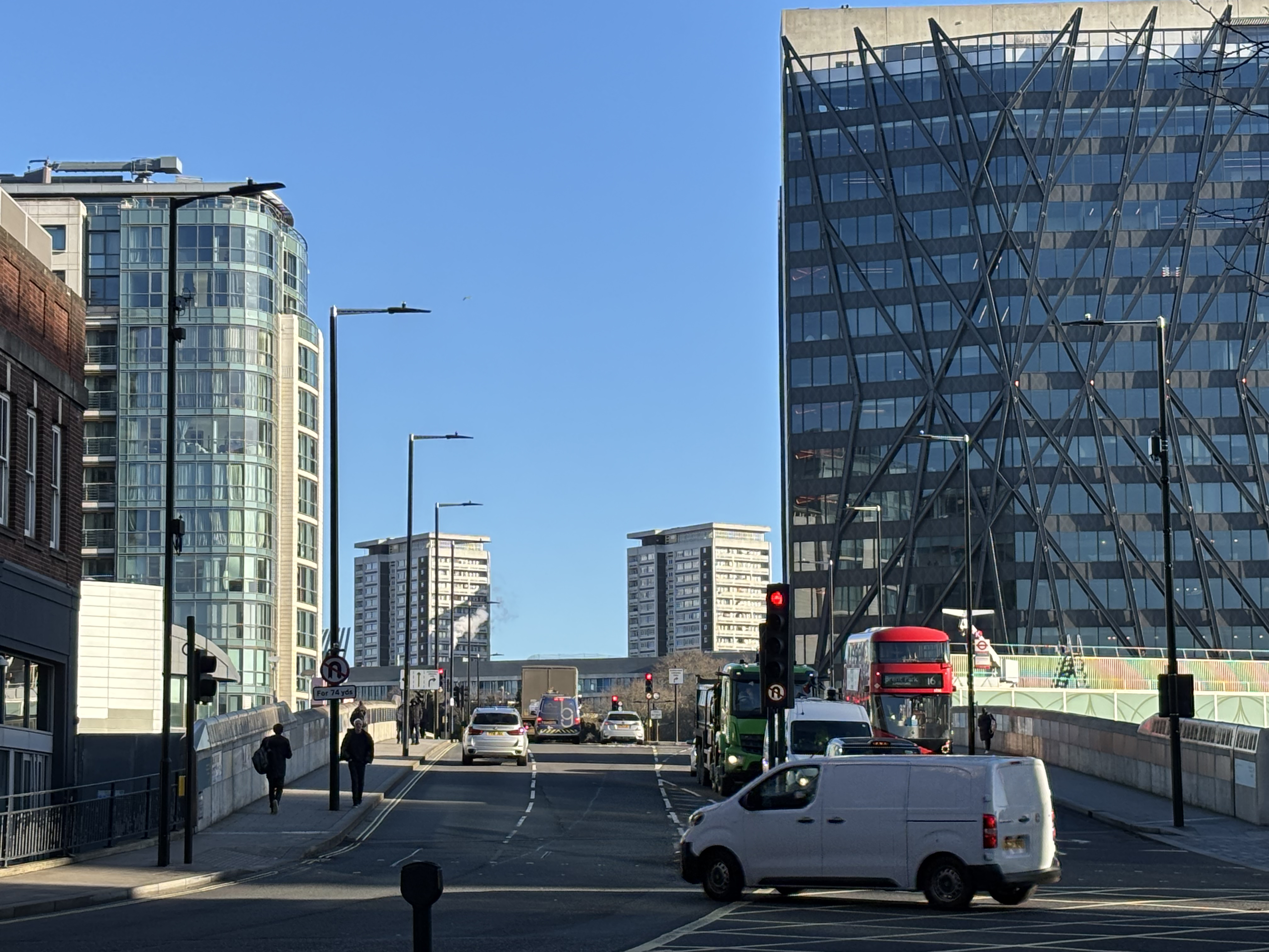 A street scene with office blocks and a road with traffice