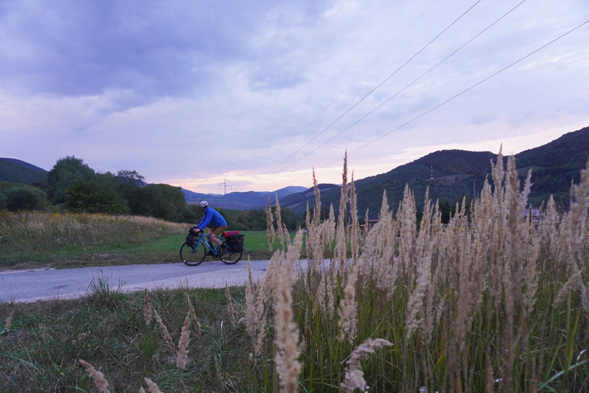 Image shows Stefan cycling in Slovakia on a bikepacking trip.