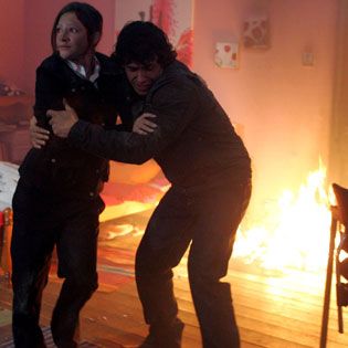 Andy attempts to save Victoria from the blaze...