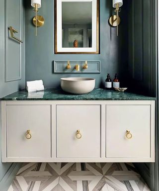 White vanity unit with green counter top