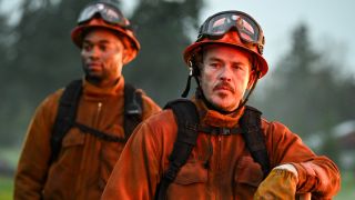 From left to right: Cole and Manny in fire gear on Fire Country.