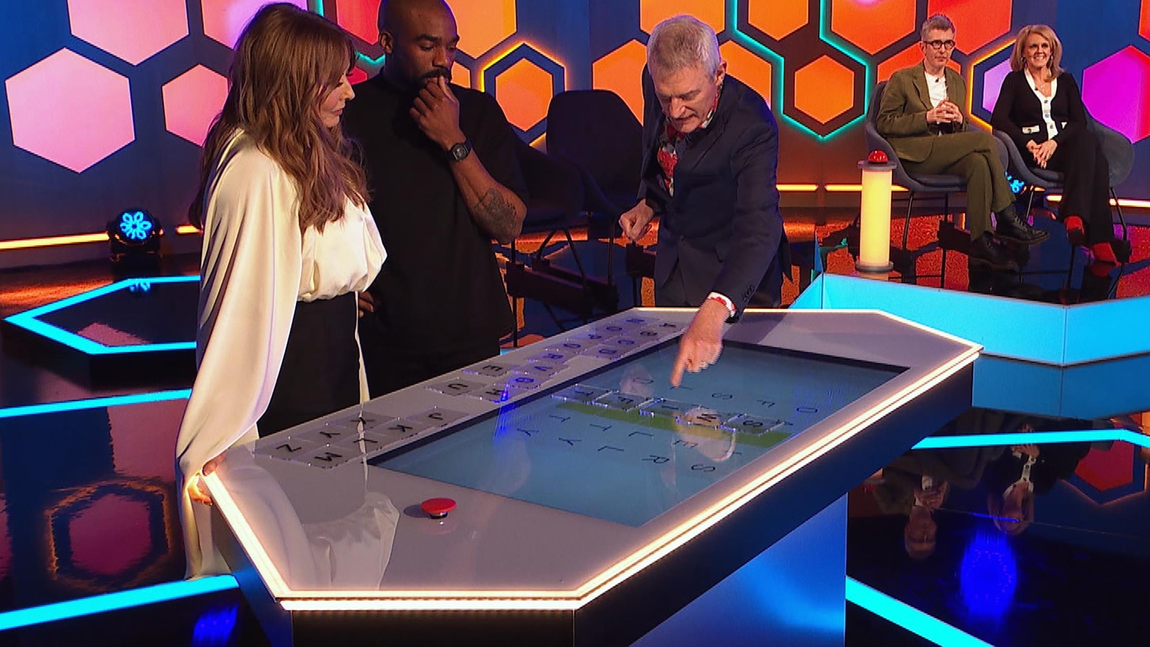 Carol and Ore tackle one of the word puzzles.