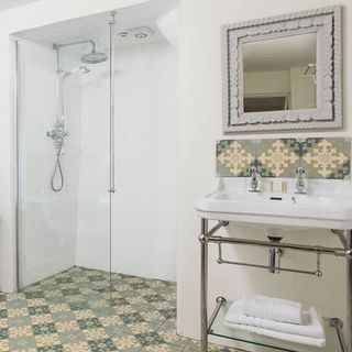 bathroom with white sink and shower area