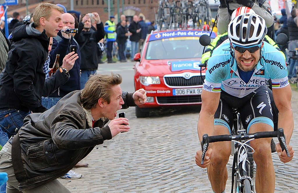 Belgian cyclist Tom Boonen of team Omega PharmaQuick Step competes in the 110th edition of the ParisRoubaix cycling race between Compiegne and Roubaix on April 8 2012 in Roubaix northern France Boonen who had previously won in 2005 2008 and 2009 equals the record of wins in ParisRoubaix held by compatriot Roger De Vlaeminck Boonen won the race ahead of French Sebatsien Turgot Team Europcar and Italys Alessandro Ballan Team BMC AFP PHOTO FRANCK FIFE Photo credit should read FRANCK FIFEAFP via Getty Images