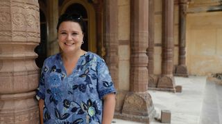 Susan on location in Susan Calman's Cruise of a lifetime wearing a blue top