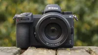 The Nikon Z7 II with an 85mm prime lens sitting on some bricks