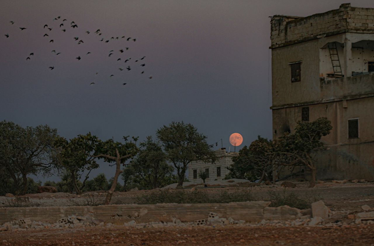 The Sturgeon Moon appears over Idlib, Syria on Aug. 21, 2021.