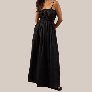 Flat lay image of woman wearing black dress