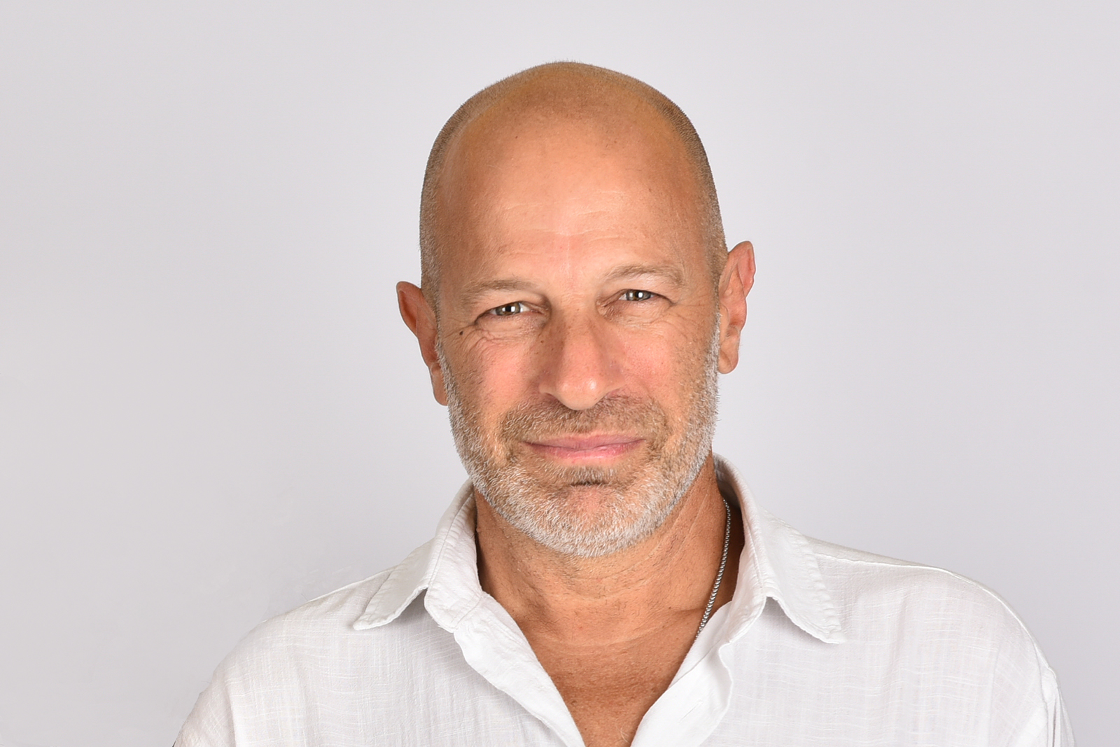 man with beard wearing white shirt
