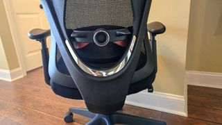 The lumbar support adjustment knob on the back of the FlexiSpot C5 office chair