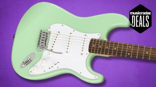 A Squier Affinity Strat on a purple background